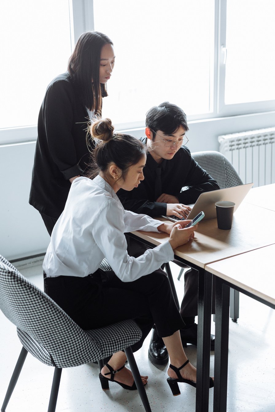 A Group of People Having a Meeting in the Office